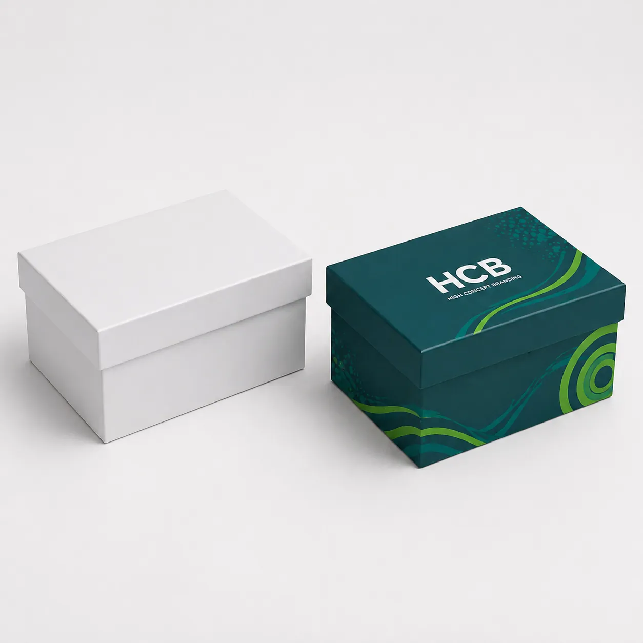 Two-piece rigid gift boxes in plain white and teal branding designs. class=